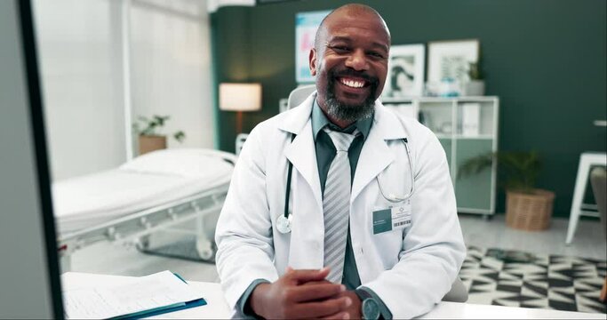 Doctor, black man and happy for healthcare in office with paperwork for medical admin or online consulting. Mature person, medicine expert and smile at workspace with confidence for career or service