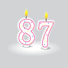 Fototapeta premium Number eighty seven. Birthday candle vector. Colorful polka dots. Grey background illustration.