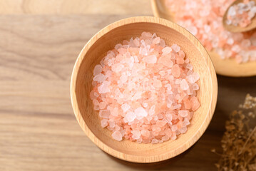 Organic Himalayan pink salt in wooden bowl, Healthy food ingredient, Table top view