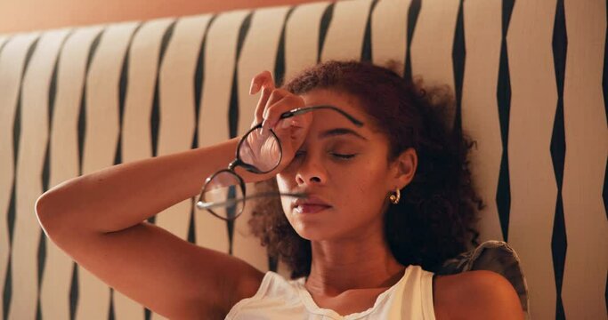 Woman, eyes and tired of glasses in home from digital reading, social media and streaming service in bed. Person, fatigue and vision fail in bedroom with burnout from online course, study or insomnia