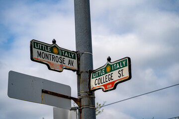 College Street and Montrose Avenue signs in the Toronto Little Italy neighborhood.