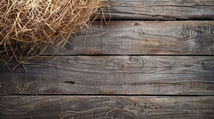 Top view of dried hay on a wooden background with space for text