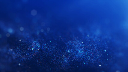 Abstract blurred sparkling or glittering particles on dark blue background.