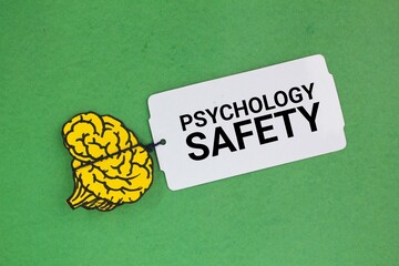 brain shape and paper tag with the word Psychological Safety. the concept of mental health