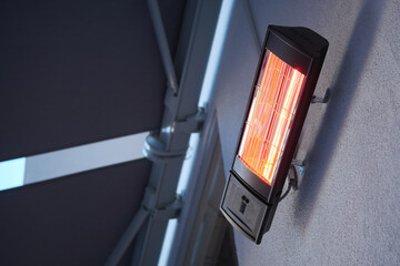 Modern electric infrared heater on celling 