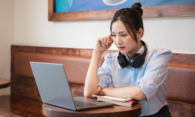 Portrait of Asian woman working at a coffee shop