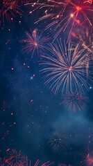 Fototapeta premium Fireworks in red, orange, and blue burst against a starry night sky, creating a vibrant and festive display