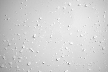 Water drops on white wall background texture