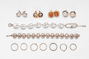 Composition with many different woman accessories on white background