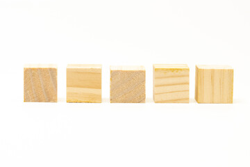 five wooden blocks isolated on white background. showimg its wooden grain.
