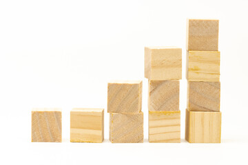 Wooden blocks or cubes in ascending order showing growth concept. Isolated in white background. Suitable for business, educational, finance, or development content.