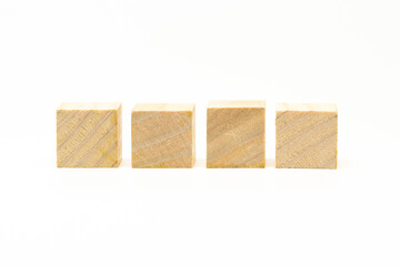 four wooden blocks isolated on white background. showing its wooden grain.