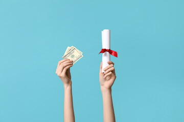 Female hands with diploma and money on blue background