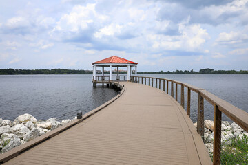 Covered lake view shelter at the end of New Broad Street in Baldwin Park, Orlando, Florida, USA.