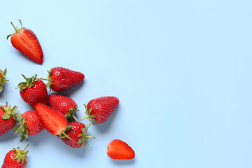 Sweet fresh strawberries on blue background