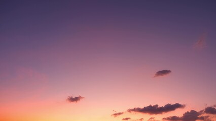 A stunning sunset with a gradient sky transitioning from deep purple at the top to warm pink and...