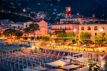 Illuminated night cityscape of Minori town. Fantastic sunset on the Mediterranean cost. Exciting...