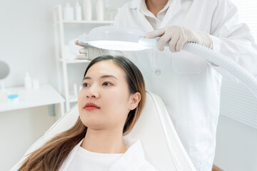 Specialist of hair recheck hair of Asian woman, damaged hair, hair loss, thinning problem, vitamin...