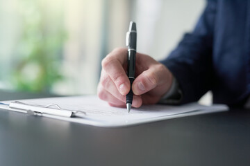 Hand, businessman and writing on document for signature for legal contract, agreement or deal for...