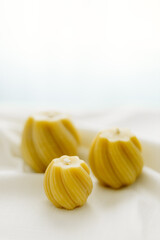 Handmade candles made from natural beeswax on a white background. Hobby. Beekeeping. Small business.