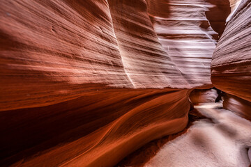 Upper Antelope Canyon, near Page, Arizona, is a breathtaking slot canyon known for its narrow passageways and vibrant sandstone walls.