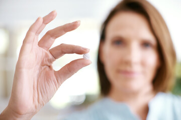 Hands, tablet and woman with medicine closeup in home for healthcare, wellness or diet supplement...