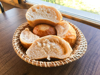 Homemade baguette in the wooden basket.
