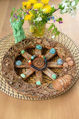 wiccan Altar for witchcraft. wheel of the year with crystals, flowers and Shaman, forest spirit figurine on table. wiccan sabbat, esoteric spiritual ritual, Crystal magic. 