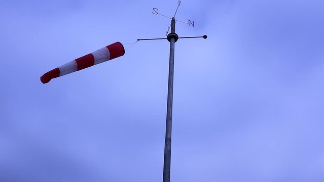 Windsock floating in the wind indicating wind strength and direction.