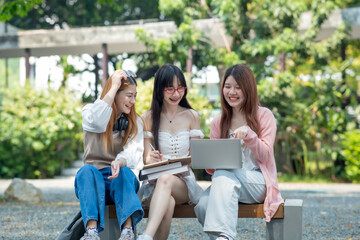 Fototapeta premium Group of young student using laptop smartphone to brain storm presentation, homework, discussing, planning to new project