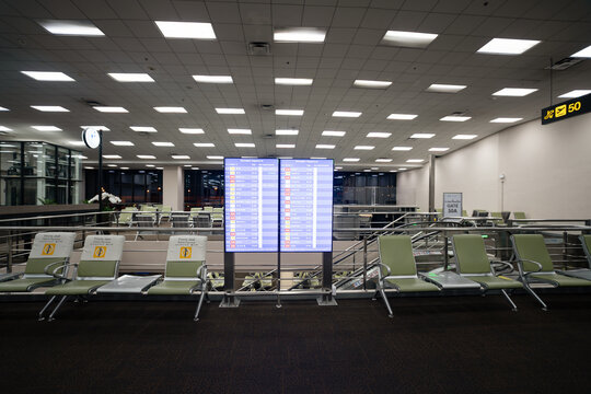 BANGKOK, THAILAND - OCTOBER 14, 2023: flight information display system as seen at shot of Don Mueang International Airport terminal.