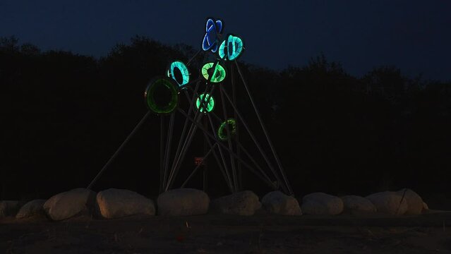 A statue light in full power at a local beach.