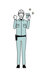 Female engineer in helmet and work wear who is pleased to see a bankbook.