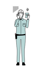 Female engineer in helmet and work wear looking at her bankbook and feeling depressed.