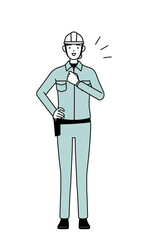 Fototapeta premium Female engineer in helmet and work wear tapping her chest.