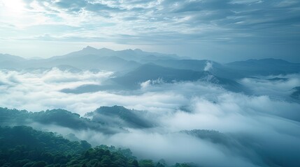 Obraz premium A breathtaking view of a misty mountain landscape, with rolling hills and a dramatic sky