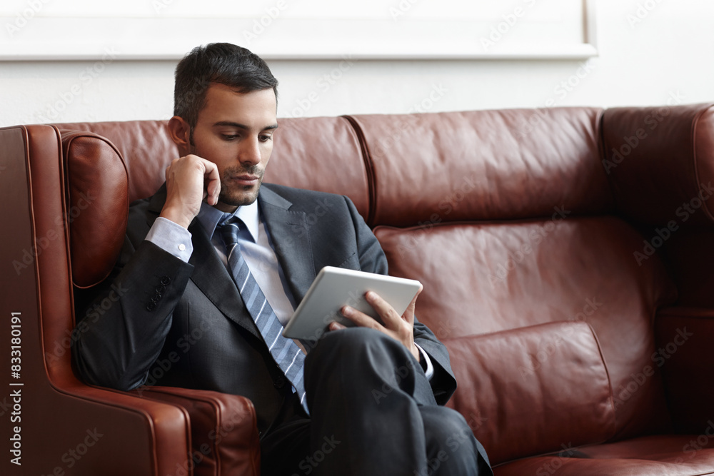 Poster reading, tablet and businessman on couch for online, research and email in waiting room. trader, sto