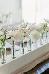 single stem bud vases as table decor at wedding reception
