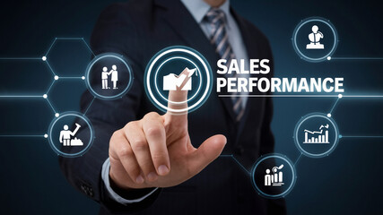 A businessman touches a virtual screen displaying "SALES PERFORMANCE" and related icons, symbolizing successful business growth. Flat lay photography on a dark background with copy space.