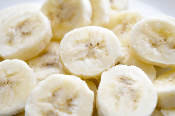 Banana slices on a white plate. Healthy and dietary food. 