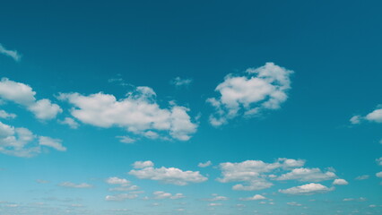 Dense Cumulus Clouds On A Clear Blue Sky. White Clouds In Blue Sky. Picturesque View Of Blue Sky...