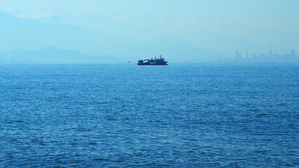 Fishing Boat Goes To Fish. Fishing Vessel Equipped With A Trawl Catches Fish. Real time.