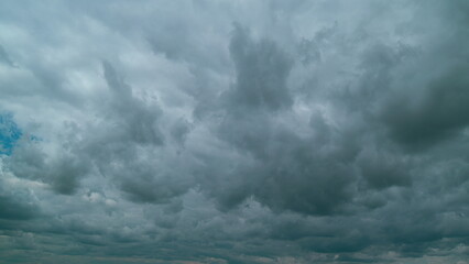 Dark Huge Cloud In Sky. Massive Cumulus Clouds Rolling. Wind Disperses Clouds On A Rainy Day.