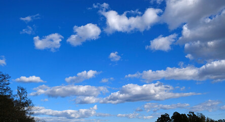 Beautiful blue sky with clouds background. Sky clouds. Air and fluffy clouds in the blue sky on a...