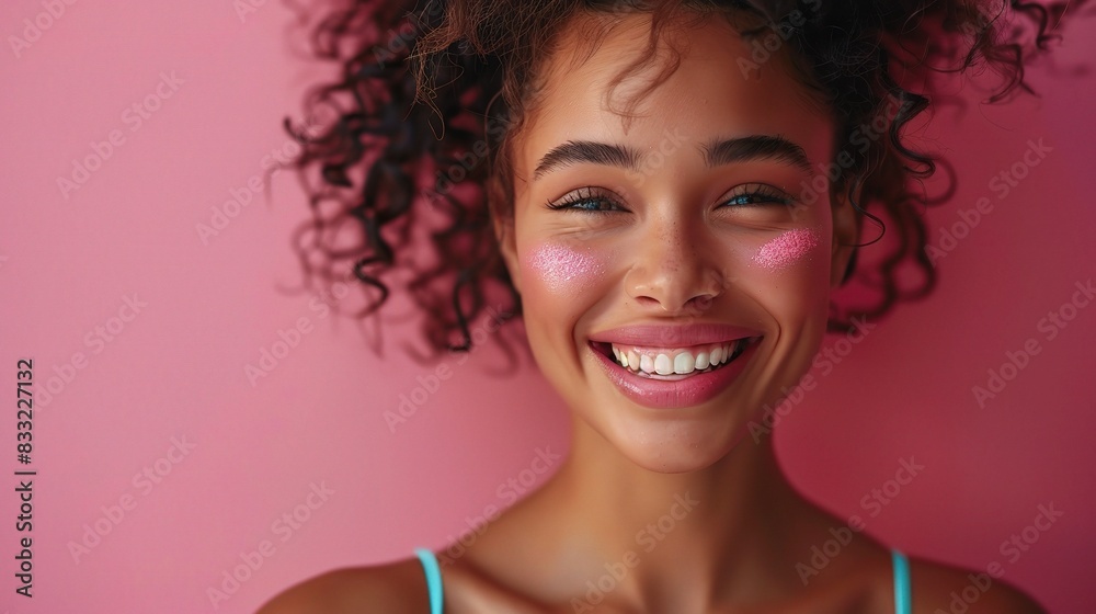 Wall mural smiling woman with glowing cheeks in fashionable underwear on a studio background