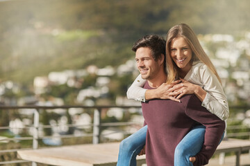 Fototapeta premium Happy man, woman and piggyback on rooftop for love, support and security in relationship. Sunshine, portrait and couple outdoors for fun, trust and excited or bonding on terrace or deck in summer