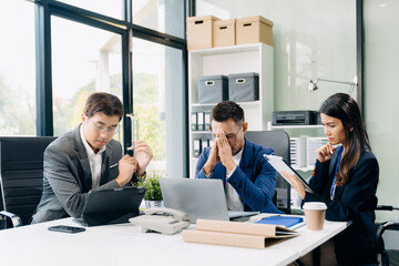 Furious two Asian businesspeople arguing strongly after making a mistake