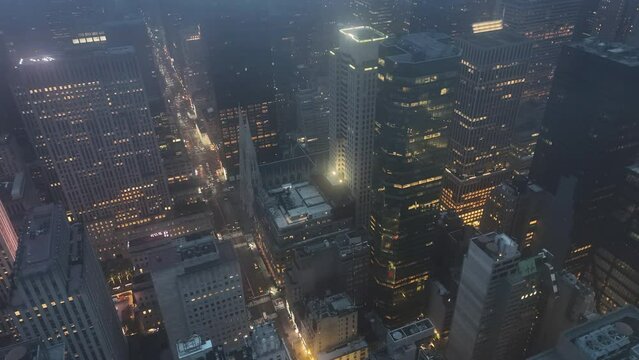 Aerial view circling the St. Patrick's Cathedral, foggy evening in New York, USA