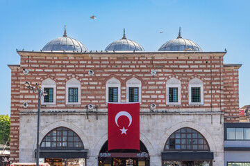The entrance to the historical Spice Bazaar in Emin&ouml;n&uuml;. Brick, stone architectural example domed structure. It is frequented by tourists. The most heavily used grand bazaar entrance.