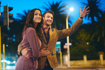 Couple, smile and calling cab at night in city with date evening outside for romance in town....